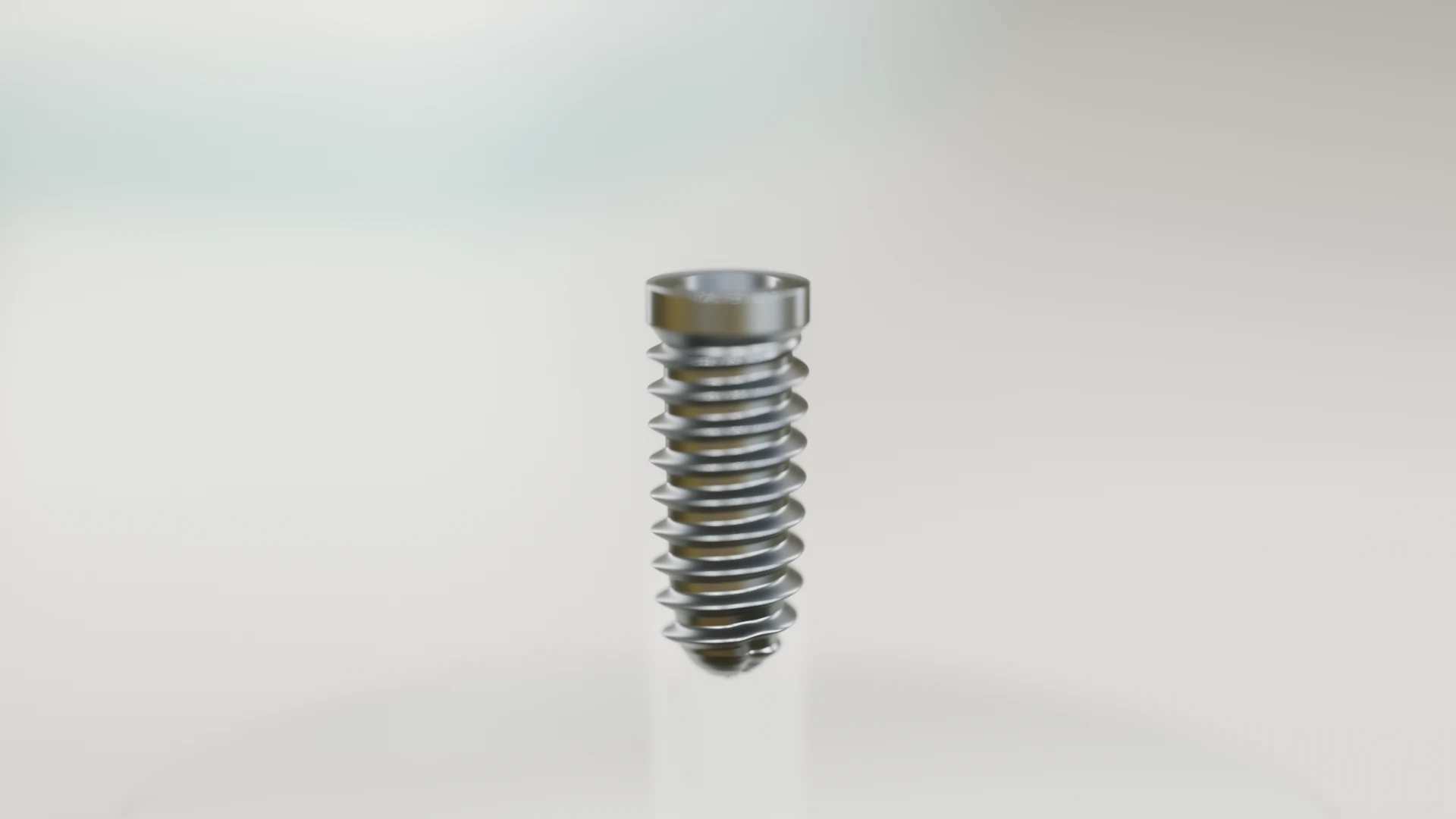Full HD macro of the titanium Kivora implant standing on a white display stand